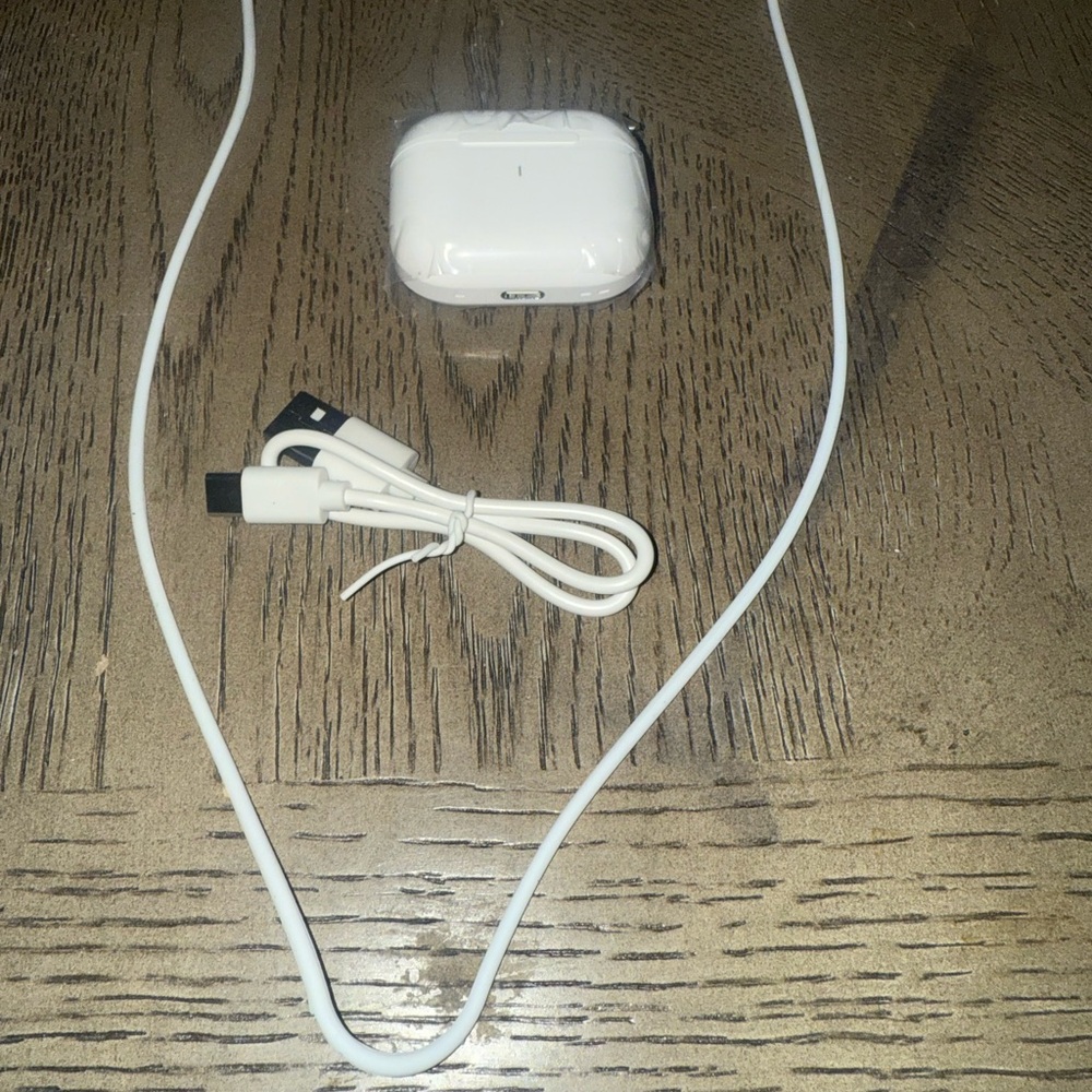 White Wireless Earbuds with Charging Cable